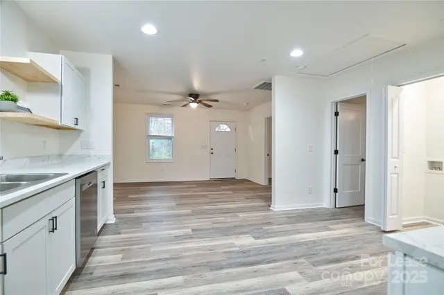 a view of a kitchen with a sink and cabinets