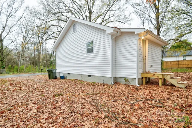 a house with trees in the background