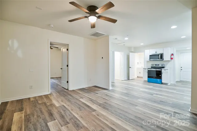 a kitchen with a refrigerator stove and microwave