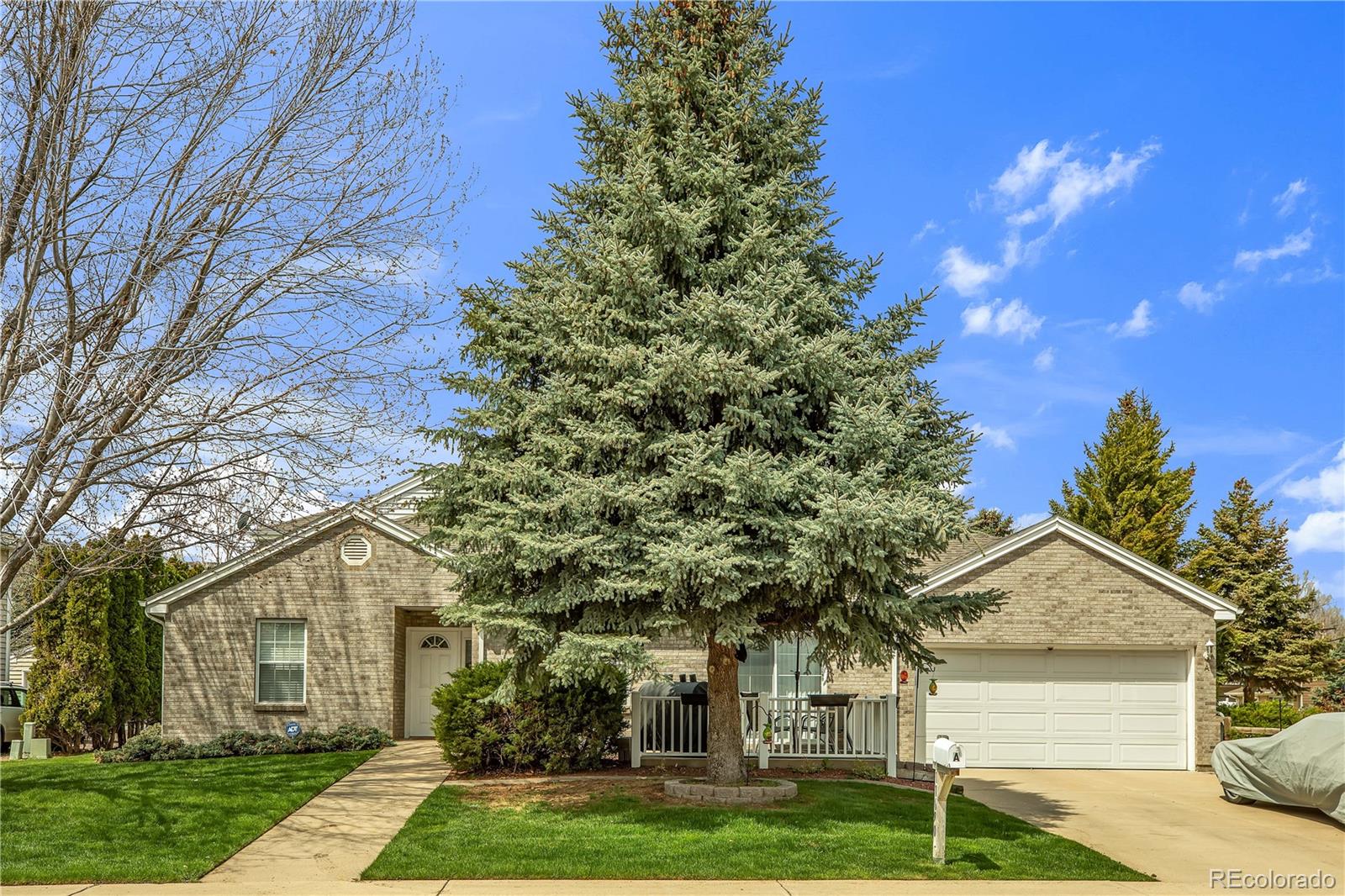11690 West 46th Avenue Wheat Ridge, CO 80033 - Photo 1 of 33 front view of a house with a yard