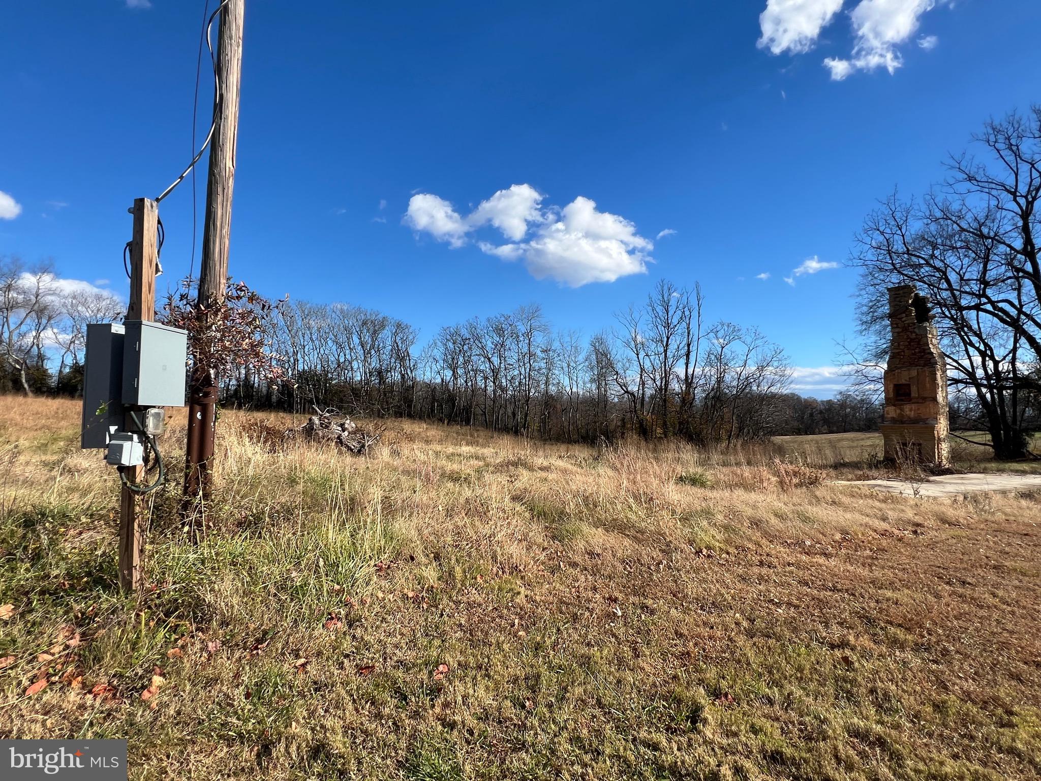 7035 Leeds Manor Road Marshall, VA 20115 - Photo 15 of 17 a view of a lake with a building in the background