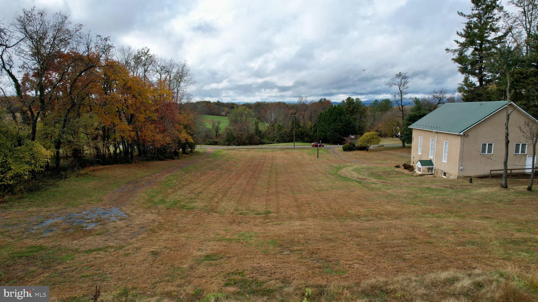 7035 Leeds Manor Road Marshall, VA 20115 - Photo 9 of 17 a view of a house with a yard