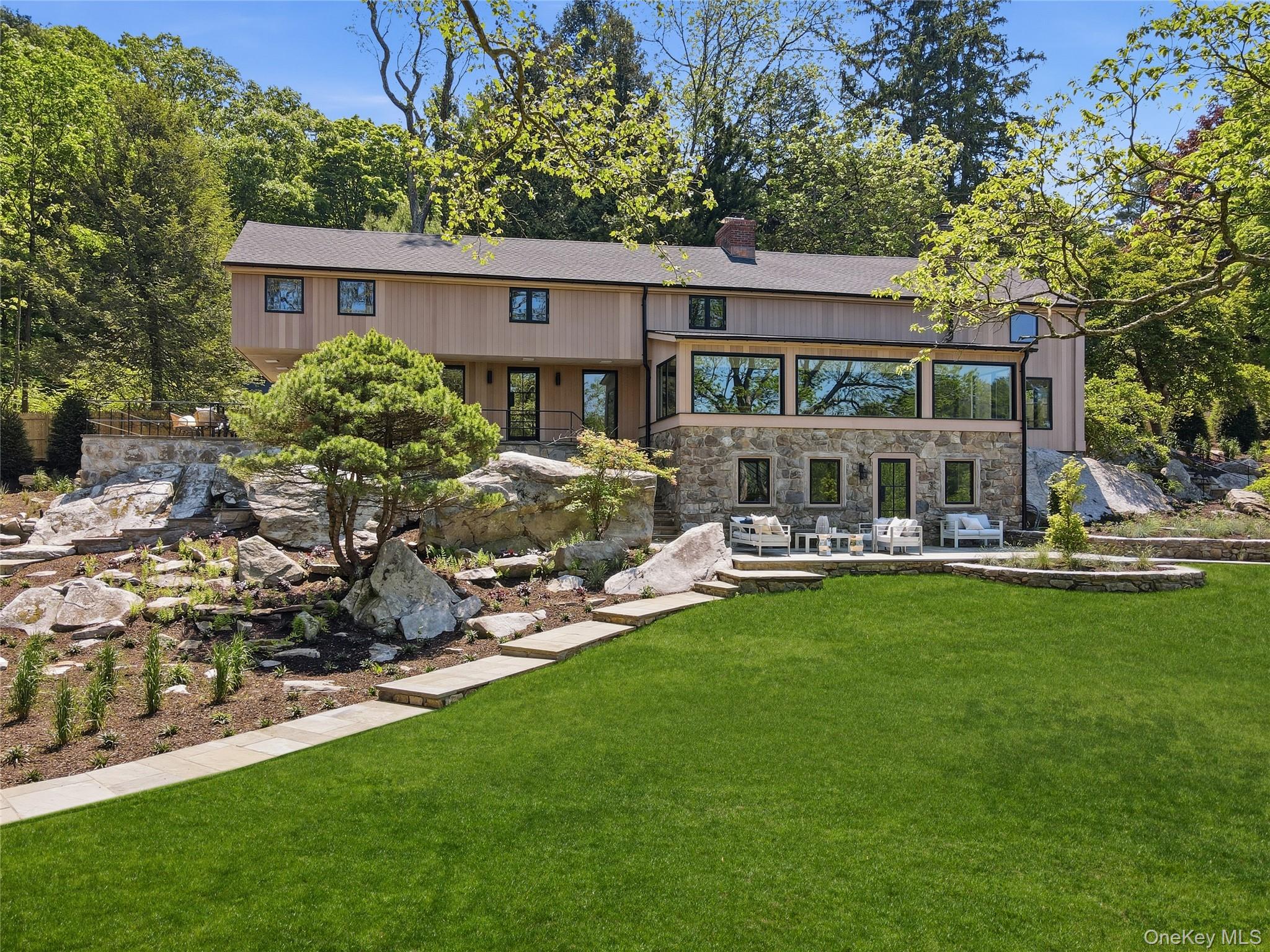39 Old Snake Hill Road Pound Ridge, NY 10576 - Photo 32 of 37 a front view of house with yard and outdoor seating