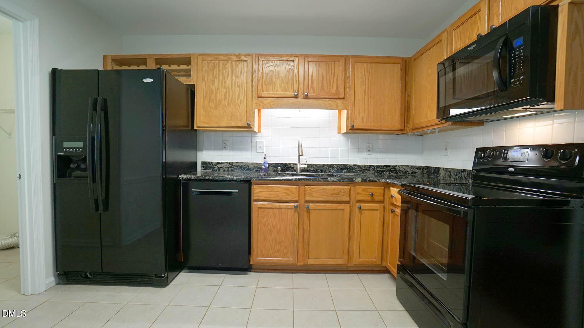 812 Havenwood Court Raleigh, NC 27615 - Photo 13 of 32 a kitchen with granite countertop cabinets stainless steel appliances and a window