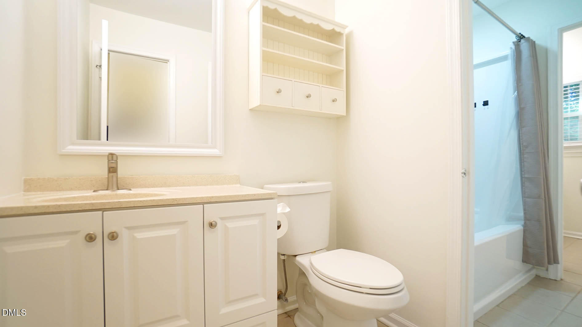 812 Havenwood Court Raleigh, NC 27615 - Photo 17 of 32 a bathroom with a sink a toilet and a mirror