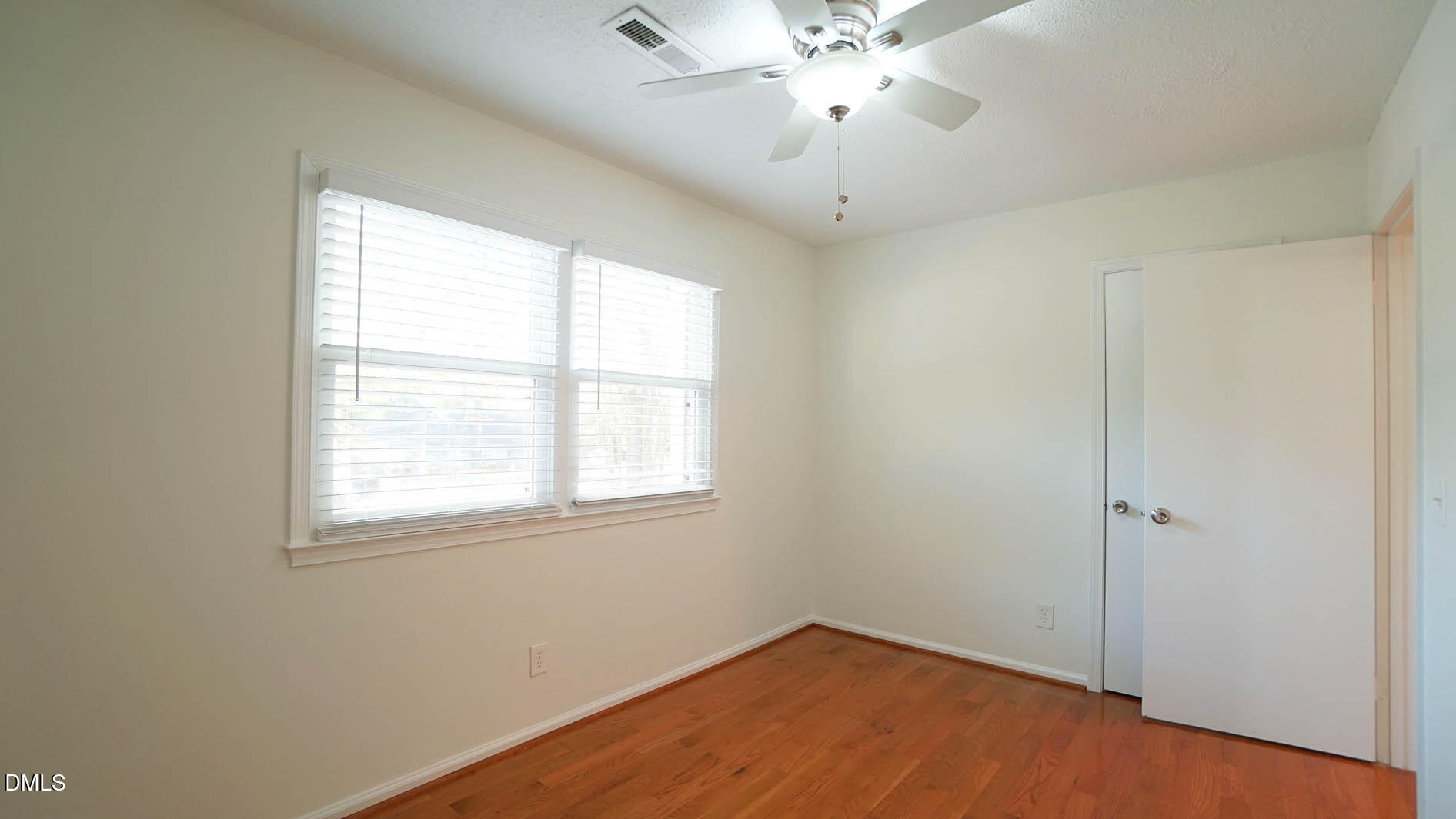 812 Havenwood Court Raleigh, NC 27615 - Photo 23 of 32 an empty room with a window and a fan