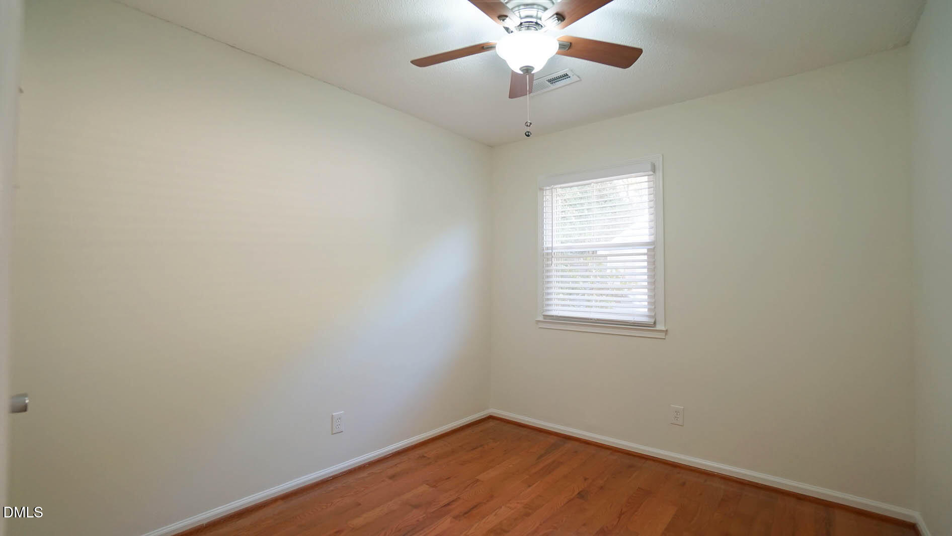 812 Havenwood Court Raleigh, NC 27615 - Photo 24 of 32 an empty room with a window and a fan