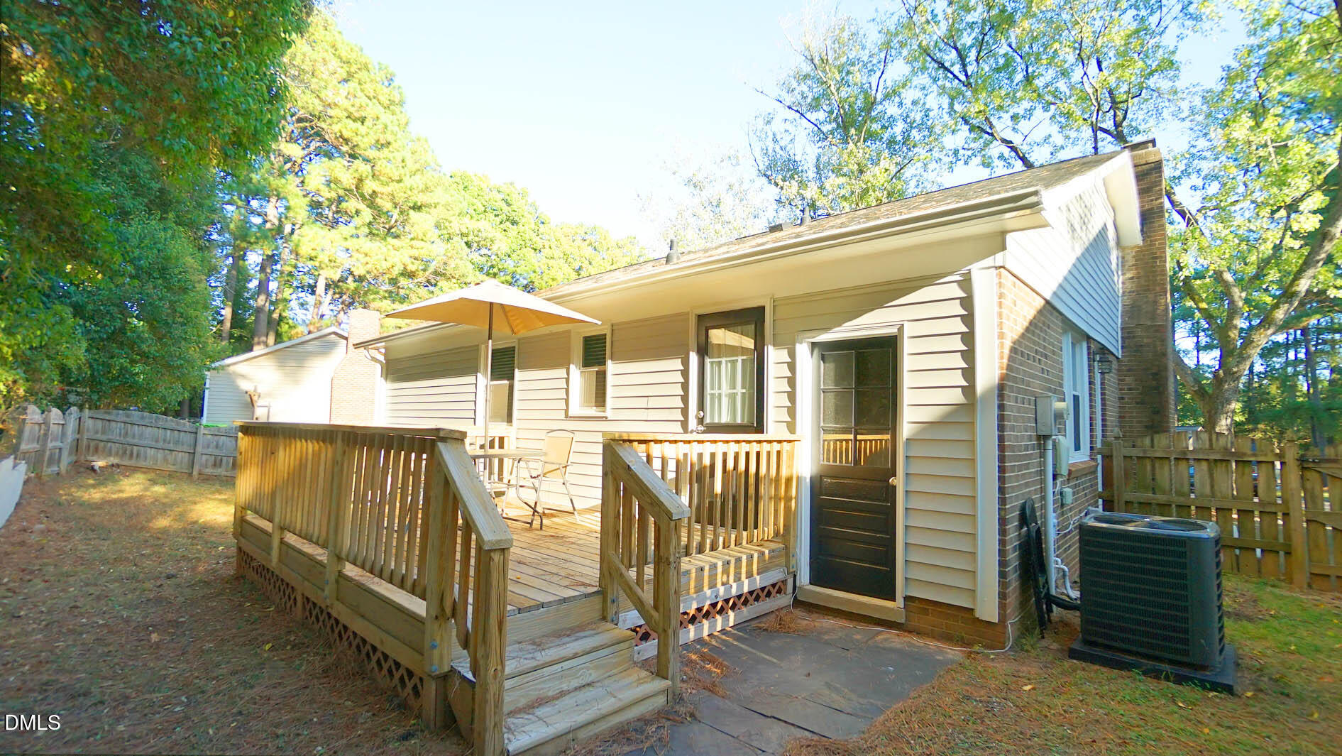 812 Havenwood Court Raleigh, NC 27615 - Photo 28 of 32 a view of a house with backyard and trees
