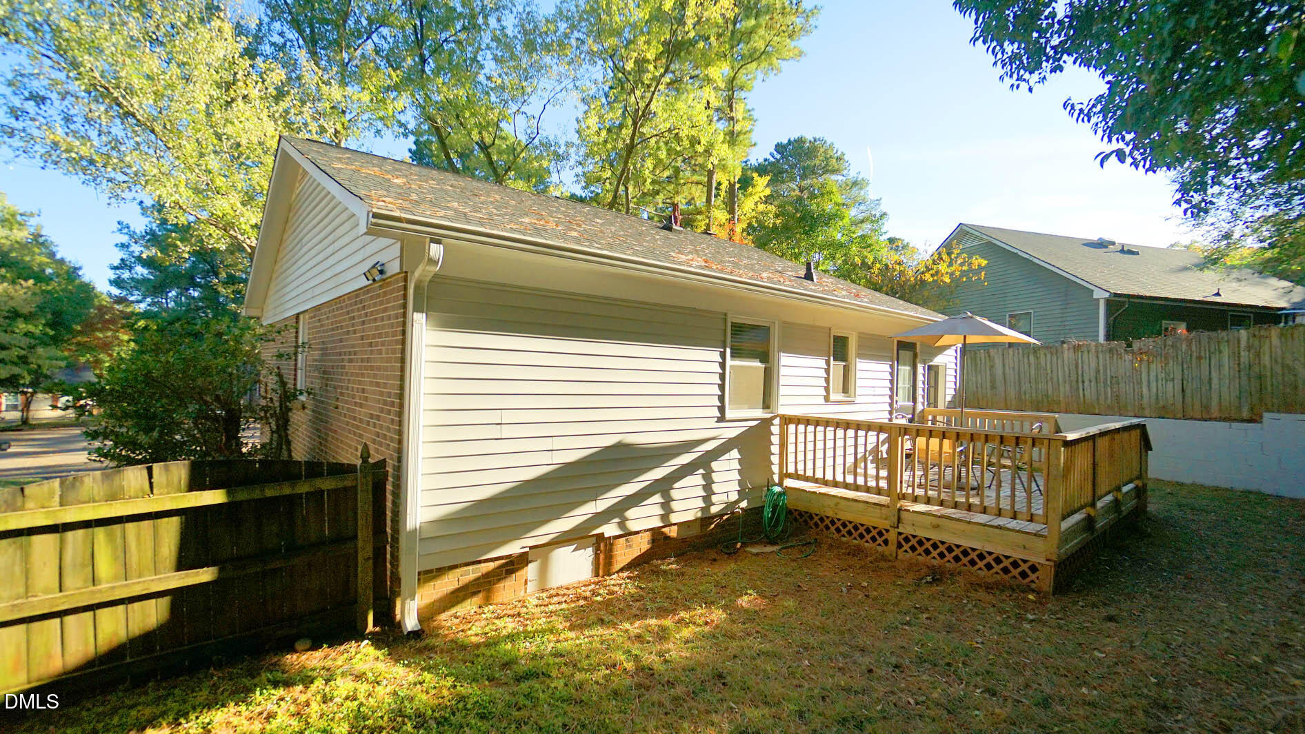 812 Havenwood Court Raleigh, NC 27615 - Photo 31 of 32 a small white house with a white roof and wooden fence