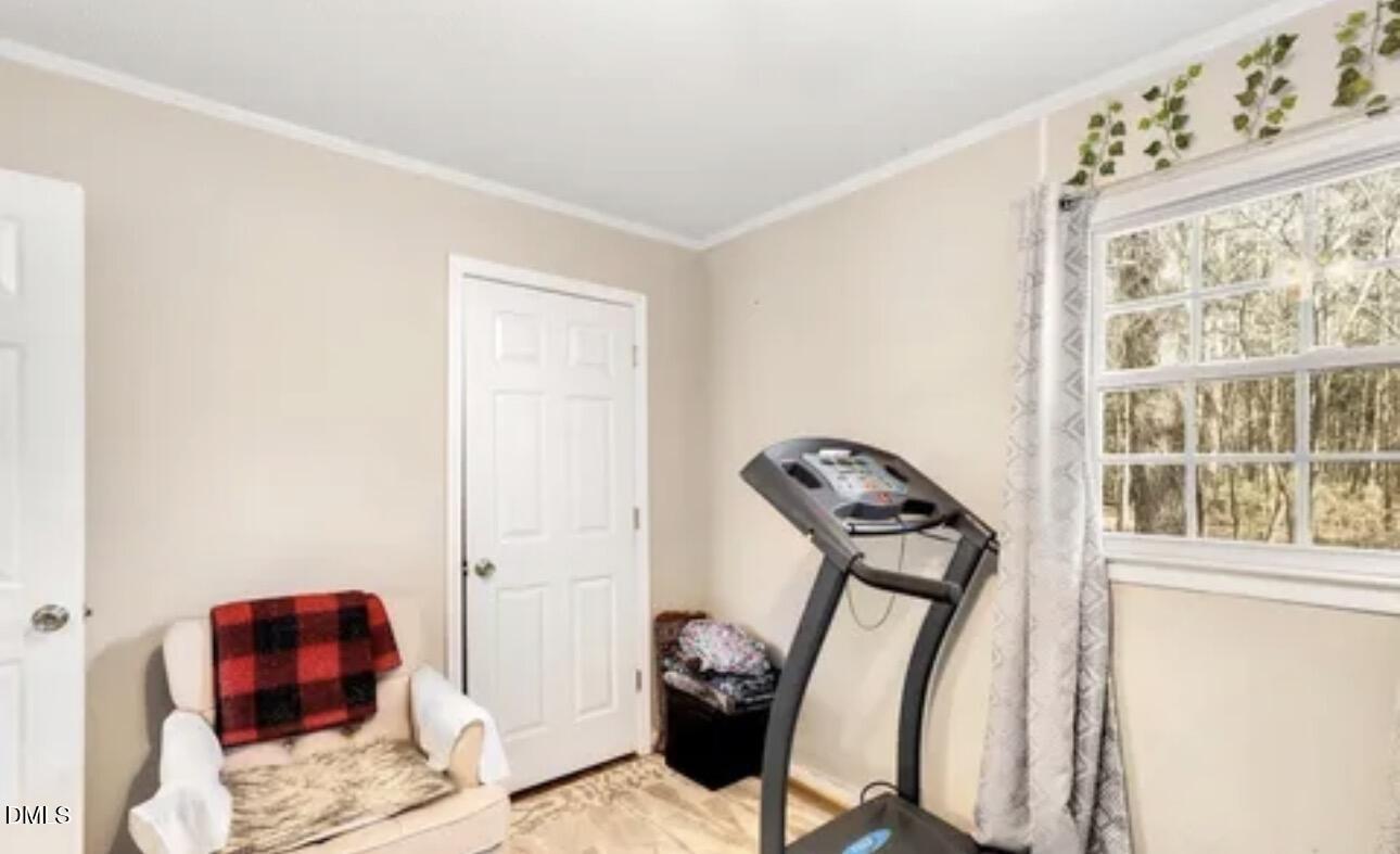 810 Milton Road Durham, NC 27712 - Photo 12 of 21 a view of a hallway with couch and a window