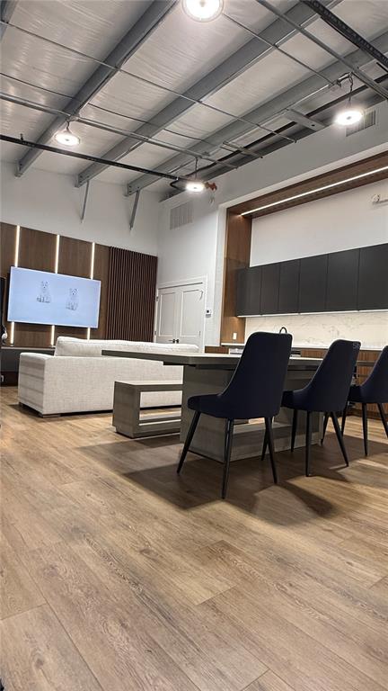 8185 Apex Way Sebring, FL 33876 - Photo 13 of 20 a room with furniture and a wooden floor