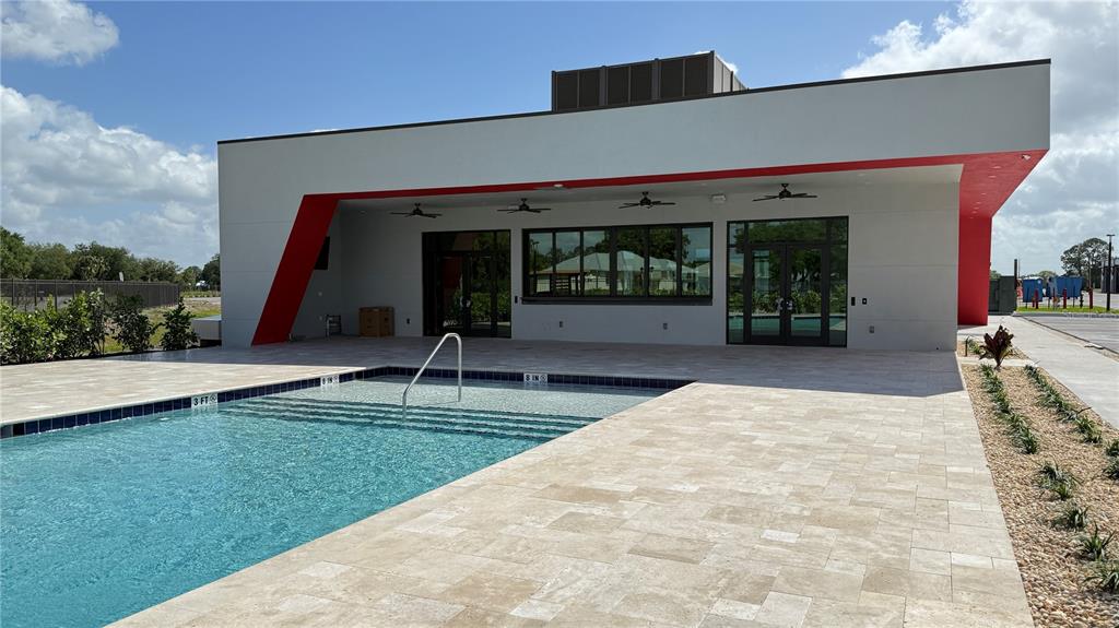 8185 Apex Way Sebring, FL 33876 - Photo 19 of 20 a view of a house with swimming pool and sitting area