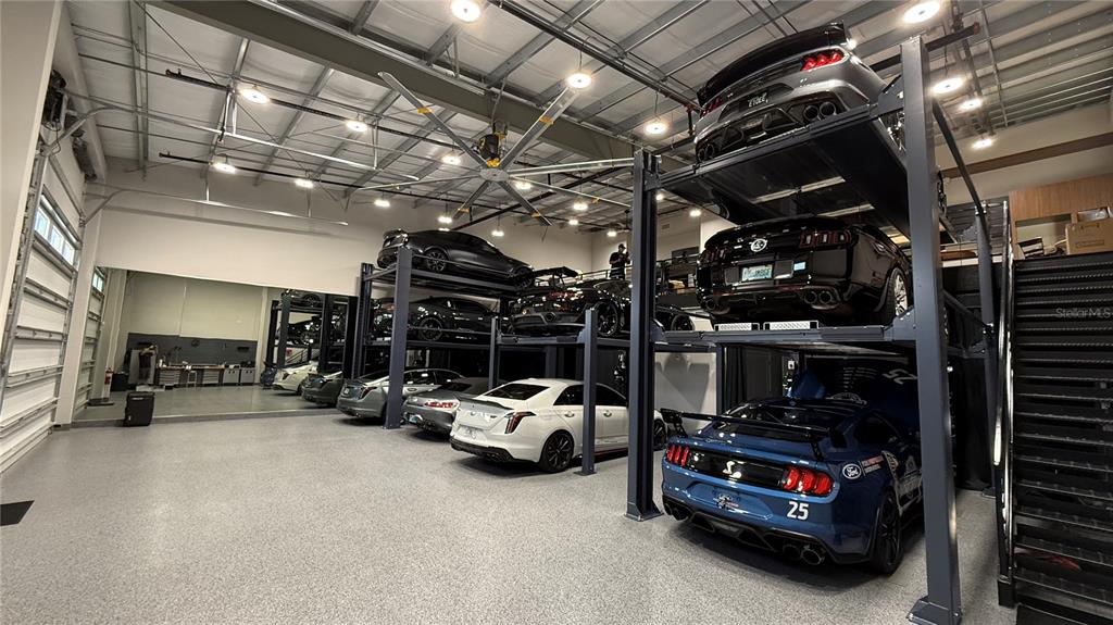 8185 Apex Way Sebring, FL 33876 - Photo 2 of 20 a car parked in a garage