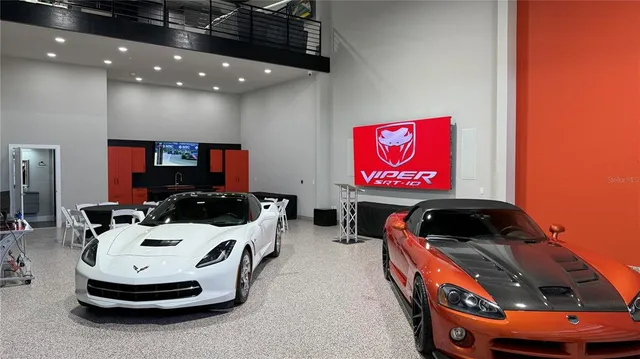 a view of a living room with furniture and a flat screen tv