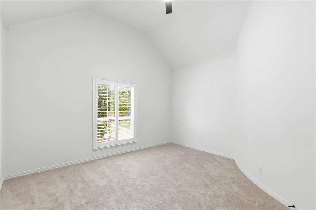 967 East Bethel School Road Coppell, TX 75019 - Photo 35 of 39 Room featuring vaulted ceilings, plantation shutters, and light-toned carpeting