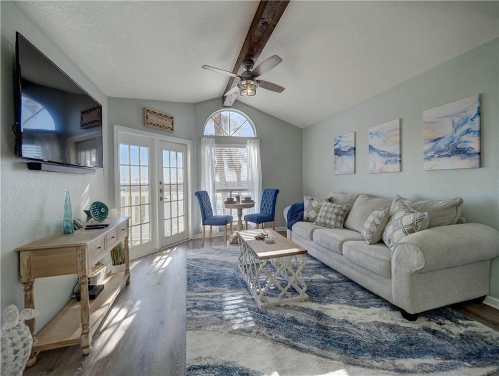 14721 Whitecap Boulevard, Unit 337 Corpus Christi, TX 78418 - Photo 3 of 28 Living room and patio access.