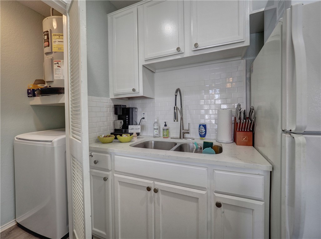 14721 Whitecap Boulevard, Unit 337 Corpus Christi, TX 78418 - Photo 10 of 28 Laundry closet in kitchen.