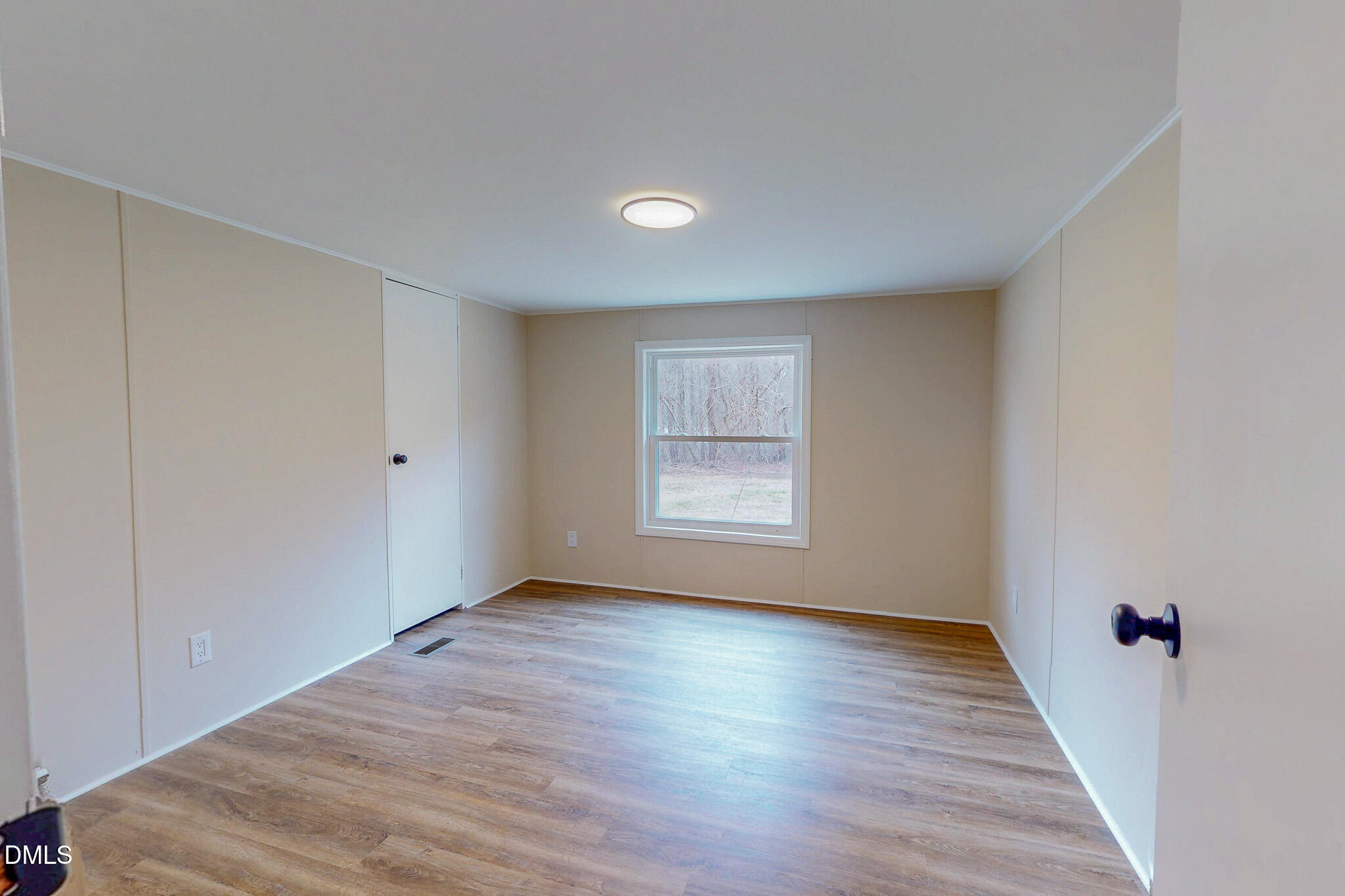 67 Halifax Road Roxboro, NC 27574 - Photo 40 of 48 a view of an empty room with wooden floor and a window