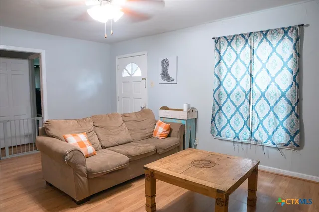 a living room with a couch and a table