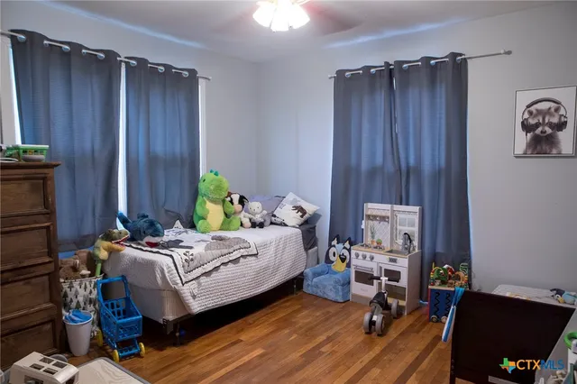 a bed room with a bed and furniture