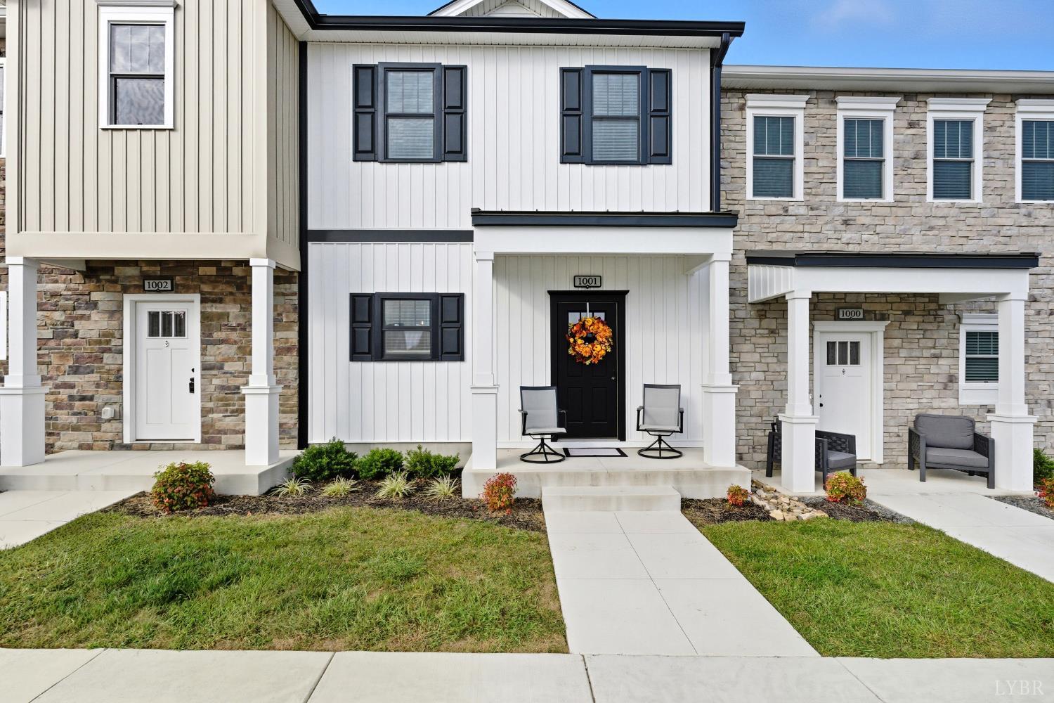 556 Leesville Road, Unit 1001 Lynchburg, VA 24502 - Photo 1 of 22 a front view of a house with garden