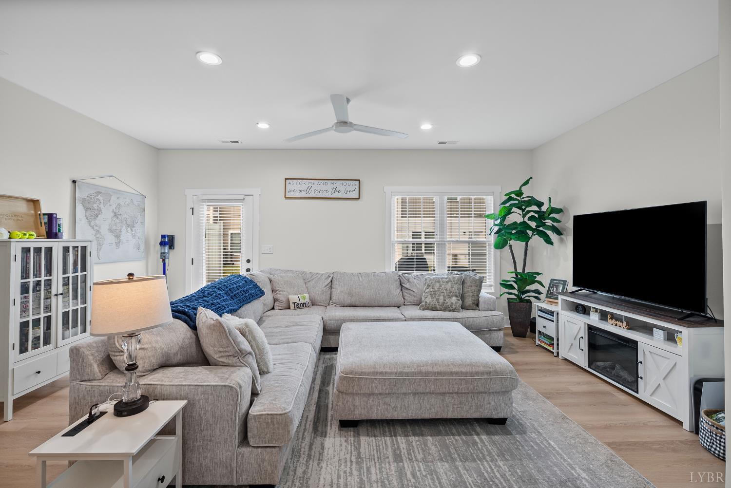 556 Leesville Road, Unit 1001 Lynchburg, VA 24502 - Photo 11 of 22 a living room with furniture and a flat screen tv