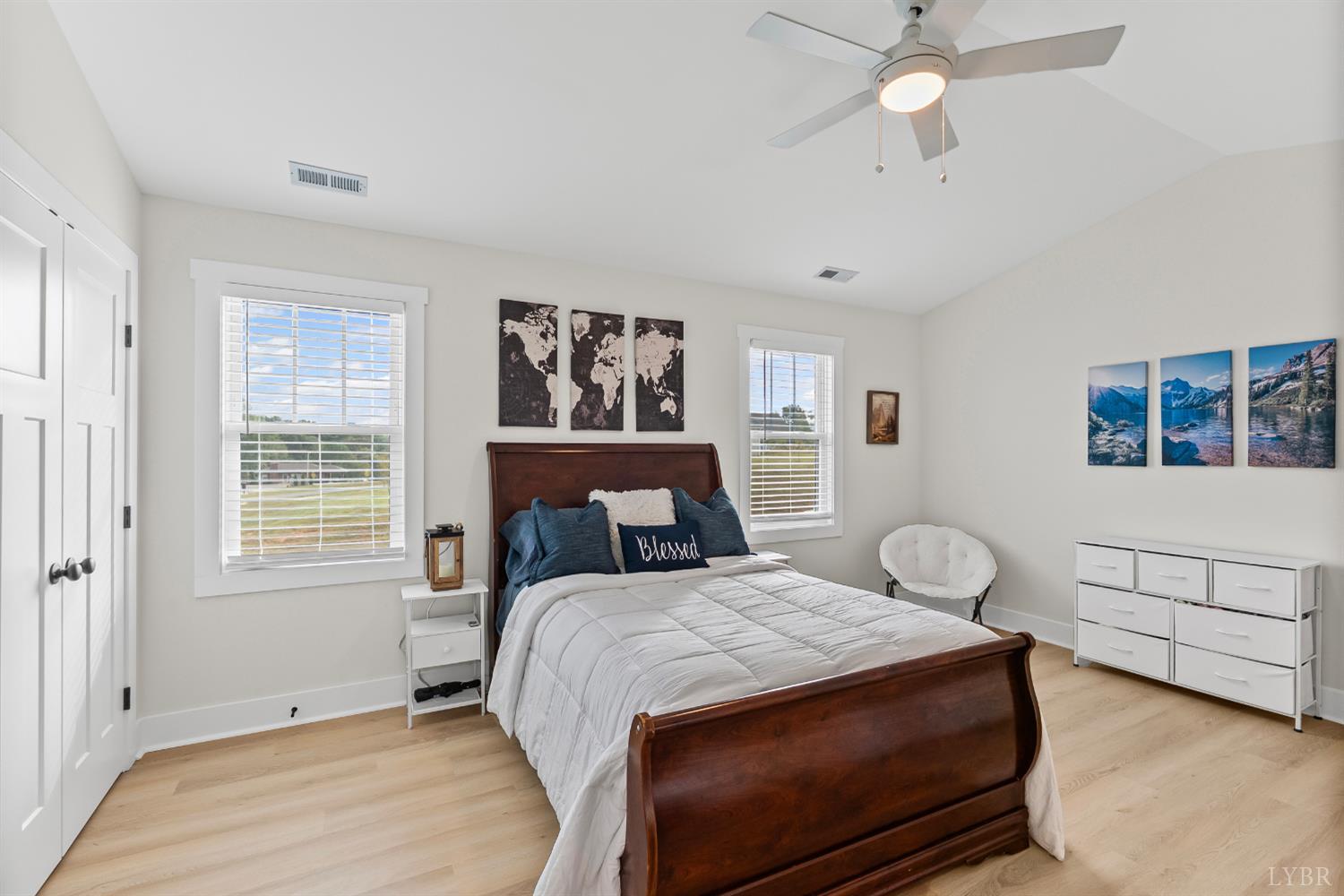 556 Leesville Road, Unit 1001 Lynchburg, VA 24502 - Photo 18 of 22 a bedroom with a large bed and a chandelier