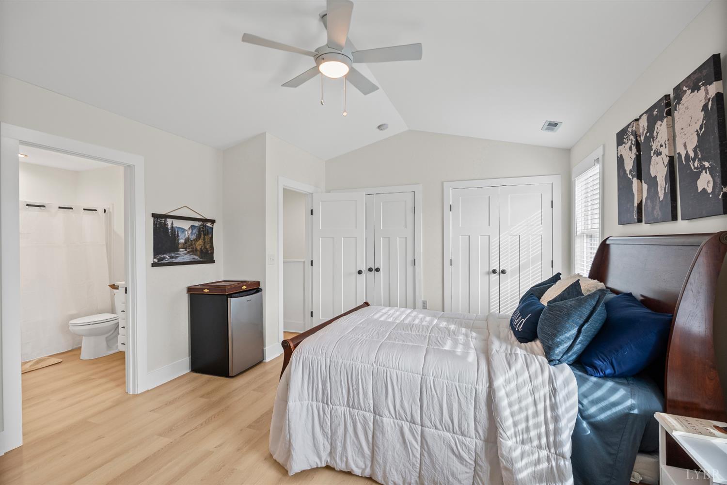 556 Leesville Road, Unit 1001 Lynchburg, VA 24502 - Photo 19 of 22 a bedroom with a bed and a chandelier