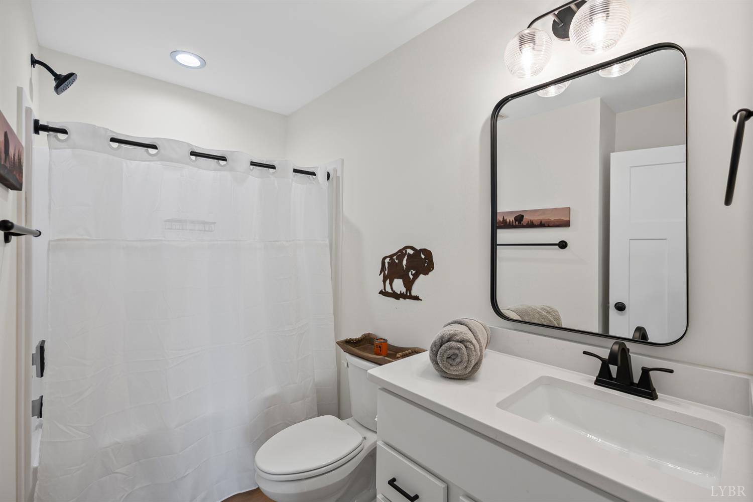 556 Leesville Road, Unit 1001 Lynchburg, VA 24502 - Photo 20 of 22 a bathroom with a granite countertop sink toilet and mirror