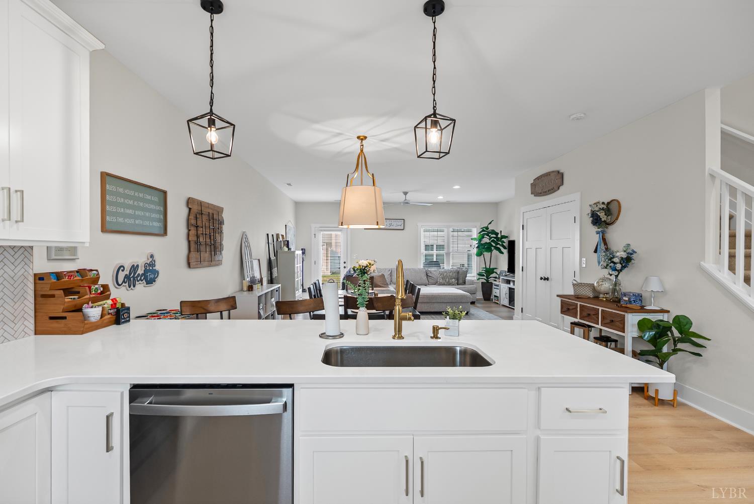 556 Leesville Road, Unit 1001 Lynchburg, VA 24502 - Photo 6 of 22 a kitchen with a sink a chandelier and living room view