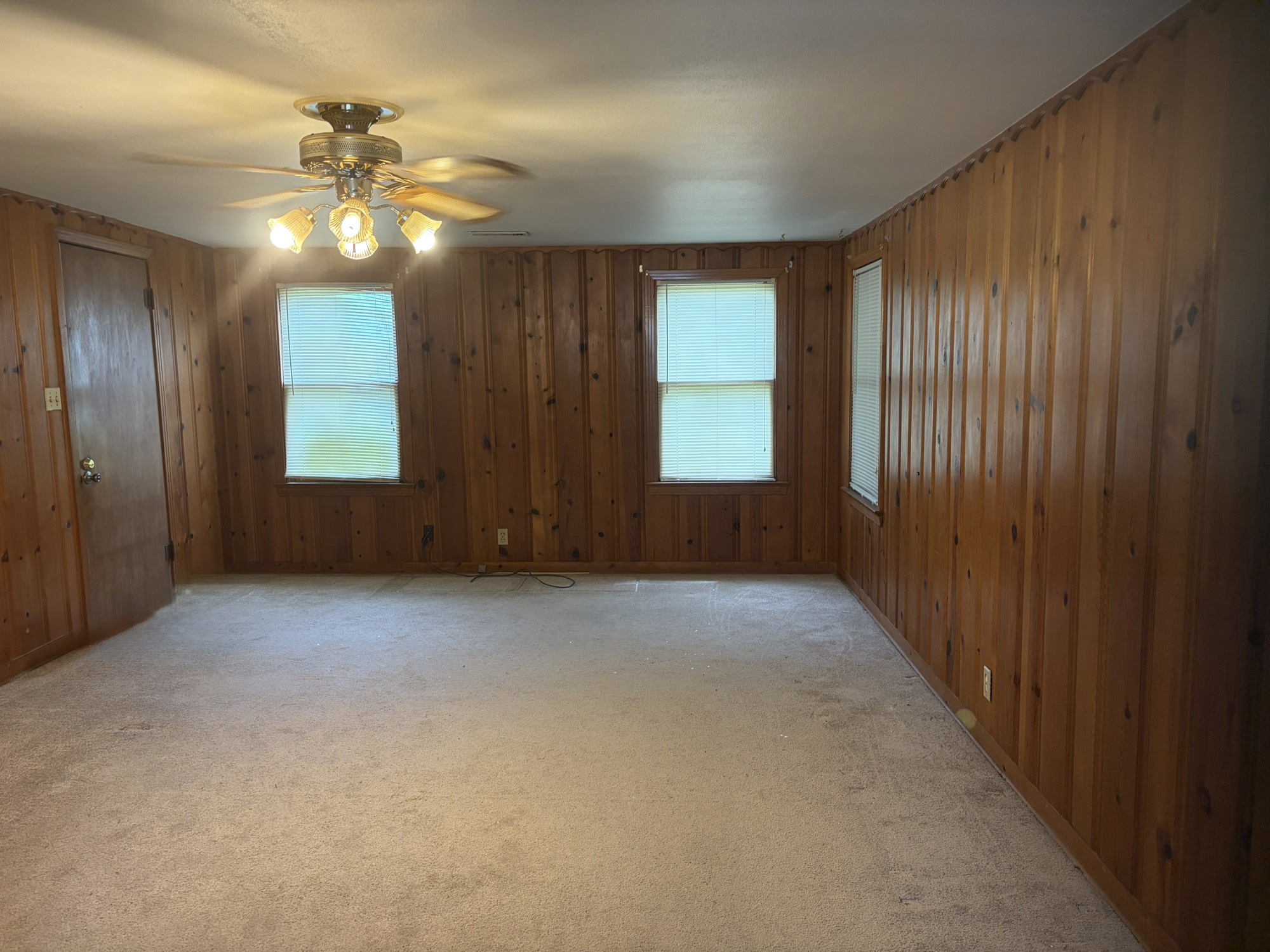 817 South Main Street Highlands, TX 77562 - Photo 5 of 17 a view of an empty room with window and chandelier fan