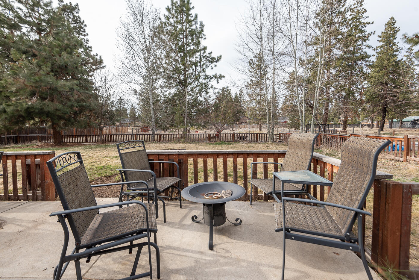 60297 Cinder Butte Road Bend, OR 97702 - Photo 15 of 22 Patio overlooking fenced yard area and chicken coop.