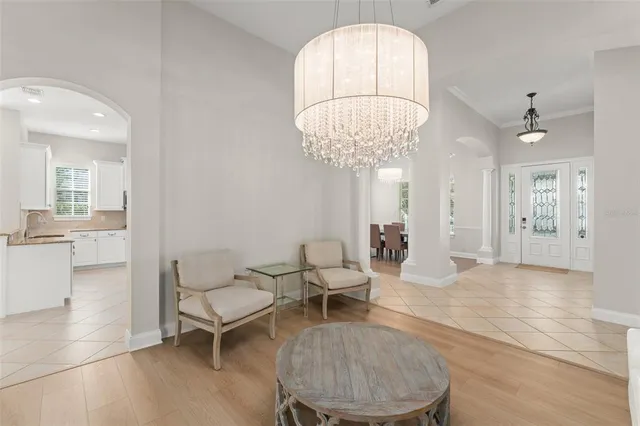 a bathroom with a granite countertop toilet a sink and a mirror