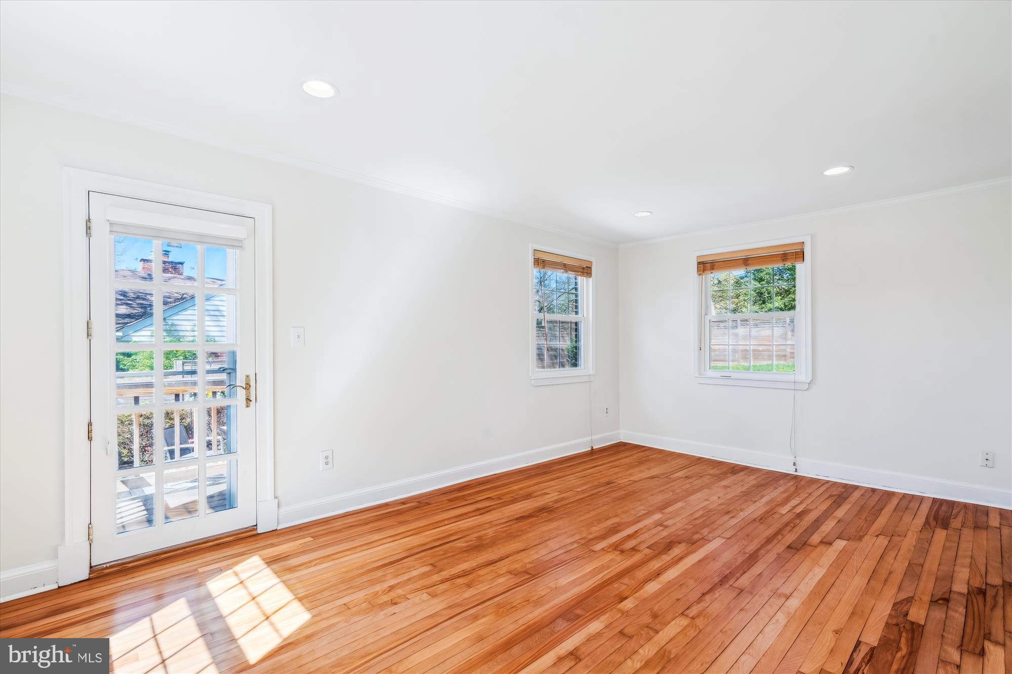 10115 Tenbrook Drive Silver Spring, MD 20901 - Photo 14 of 53 a view of empty room with wooden floor and fan
