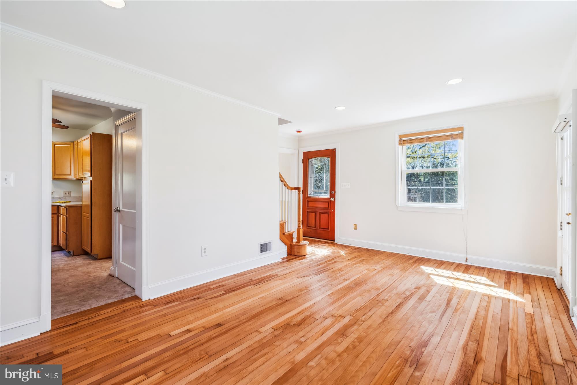 10115 Tenbrook Drive Silver Spring, MD 20901 - Photo 17 of 53 an empty room with wooden floor and a window