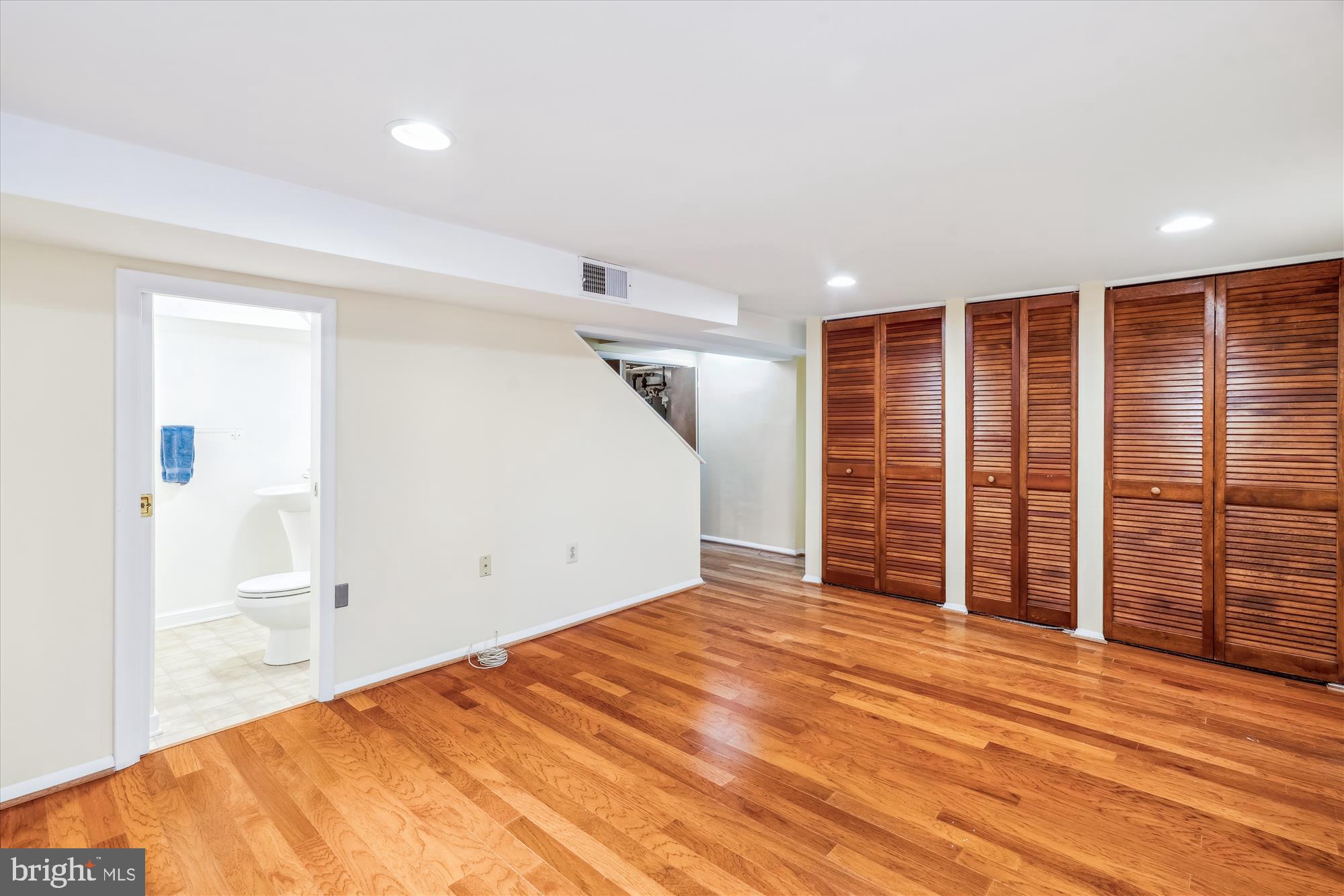 10115 Tenbrook Drive Silver Spring, MD 20901 - Photo 28 of 53 a view of empty room with wooden floor and fan