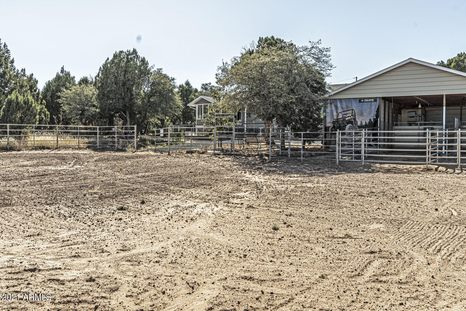1057 Casper Lane Show Low, AZ 85901 - Photo 33 of 37 horse arena from stalls