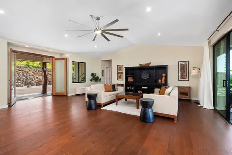 a kitchen with stainless steel appliances a dining table chairs stove and refrigerator