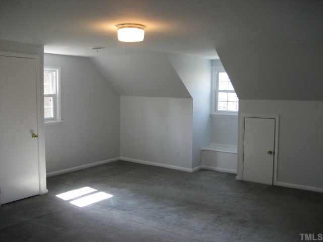 1427 Seminole Trail Raleigh, NC 27609 - Photo 8 of 8 an empty room with windows