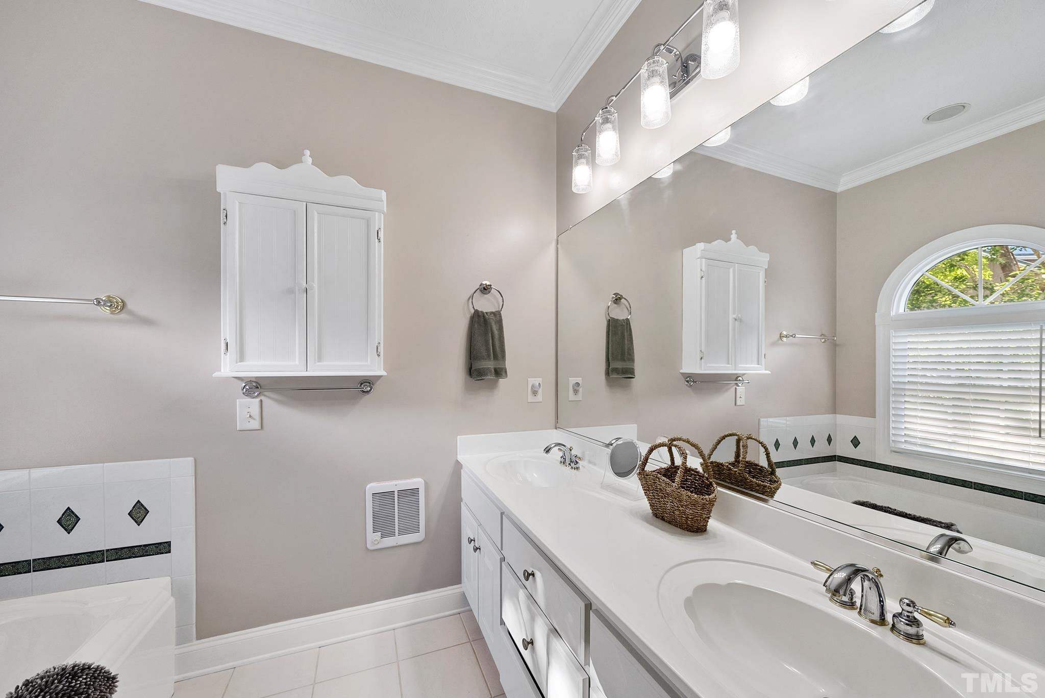 339 Velvet Road Semora, NC 27343 - Photo 17 of 68 a bathroom with double vanity sink and a mirror