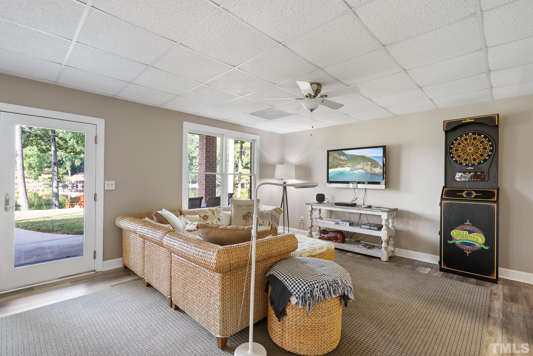 339 Velvet Road Semora, NC 27343 - Photo 33 of 68 a living room with furniture and a flat screen tv