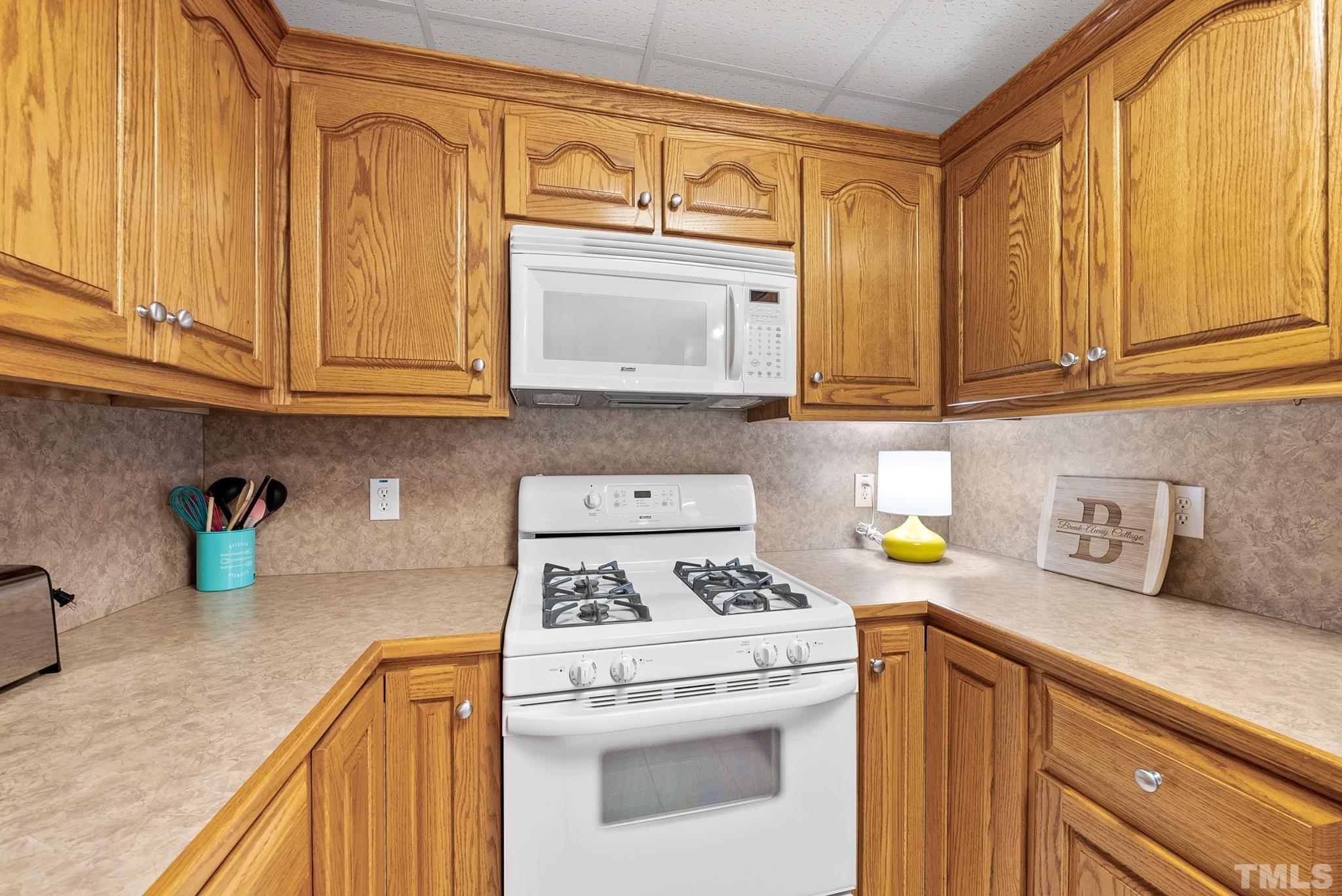339 Velvet Road Semora, NC 27343 - Photo 42 of 68 a kitchen with stainless steel appliances granite countertop a sink a stove and cabinets