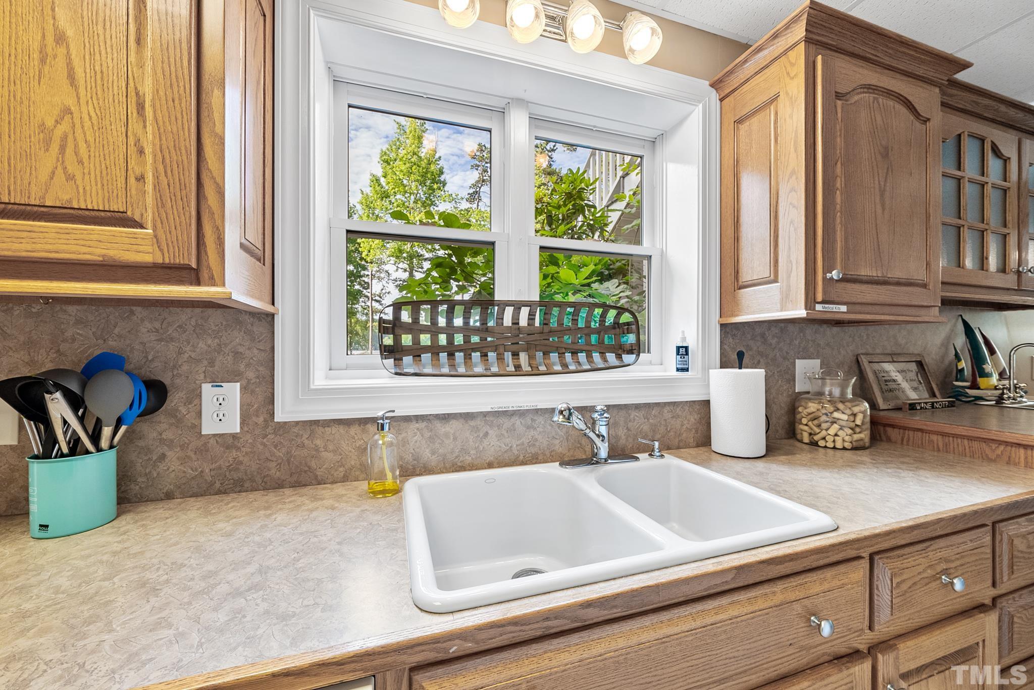 339 Velvet Road Semora, NC 27343 - Photo 45 of 68 a bathroom with a granite countertop sink and a window