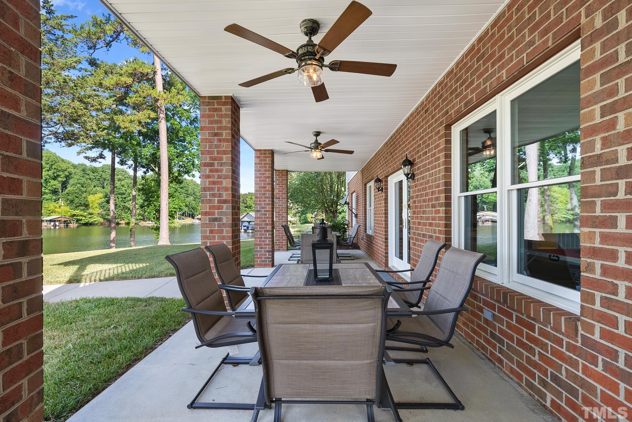 339 Velvet Road Semora, NC 27343 - Photo 48 of 68 a view of a patio with a dining table and chairs