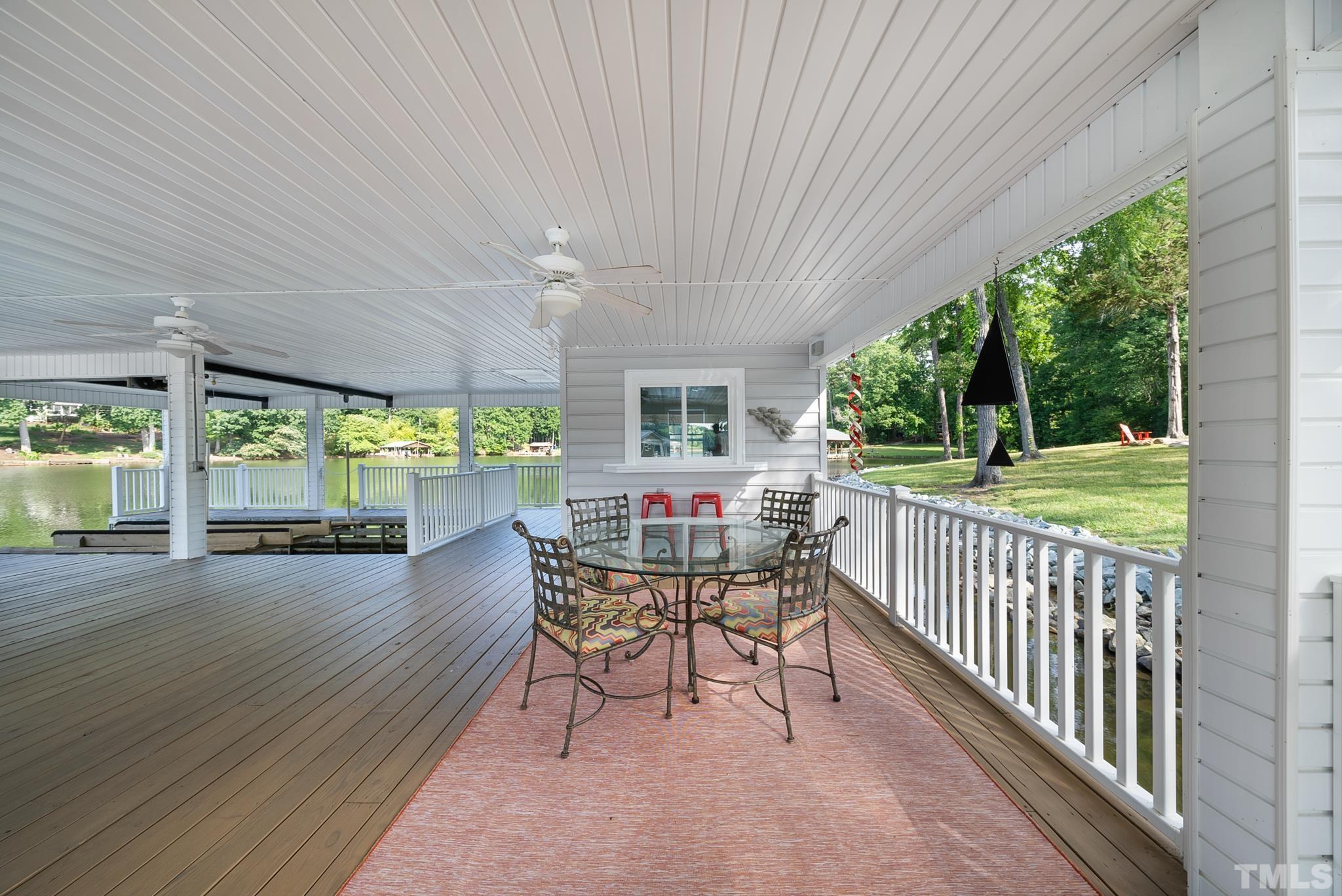 339 Velvet Road Semora, NC 27343 - Photo 55 of 68 a view of a patio with a table chairs and backyard