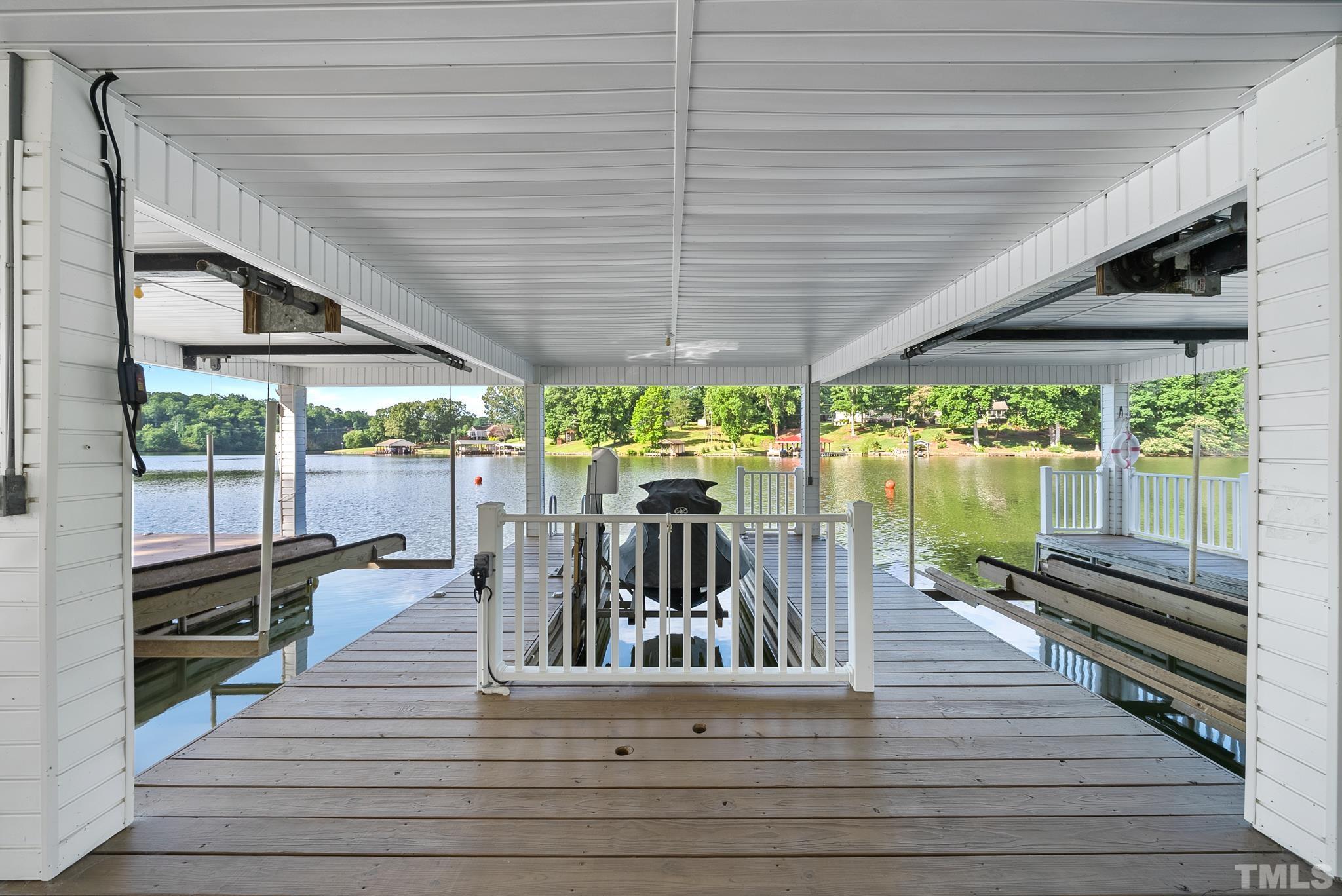 339 Velvet Road Semora, NC 27343 - Photo 56 of 68 a view of a patio with chairs and wooden floor