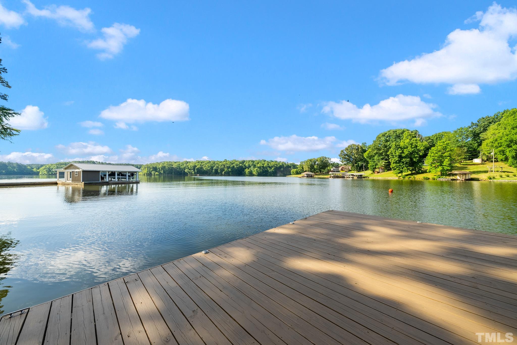 339 Velvet Road Semora, NC 27343 - Photo 57 of 68 a view of a lake with houses