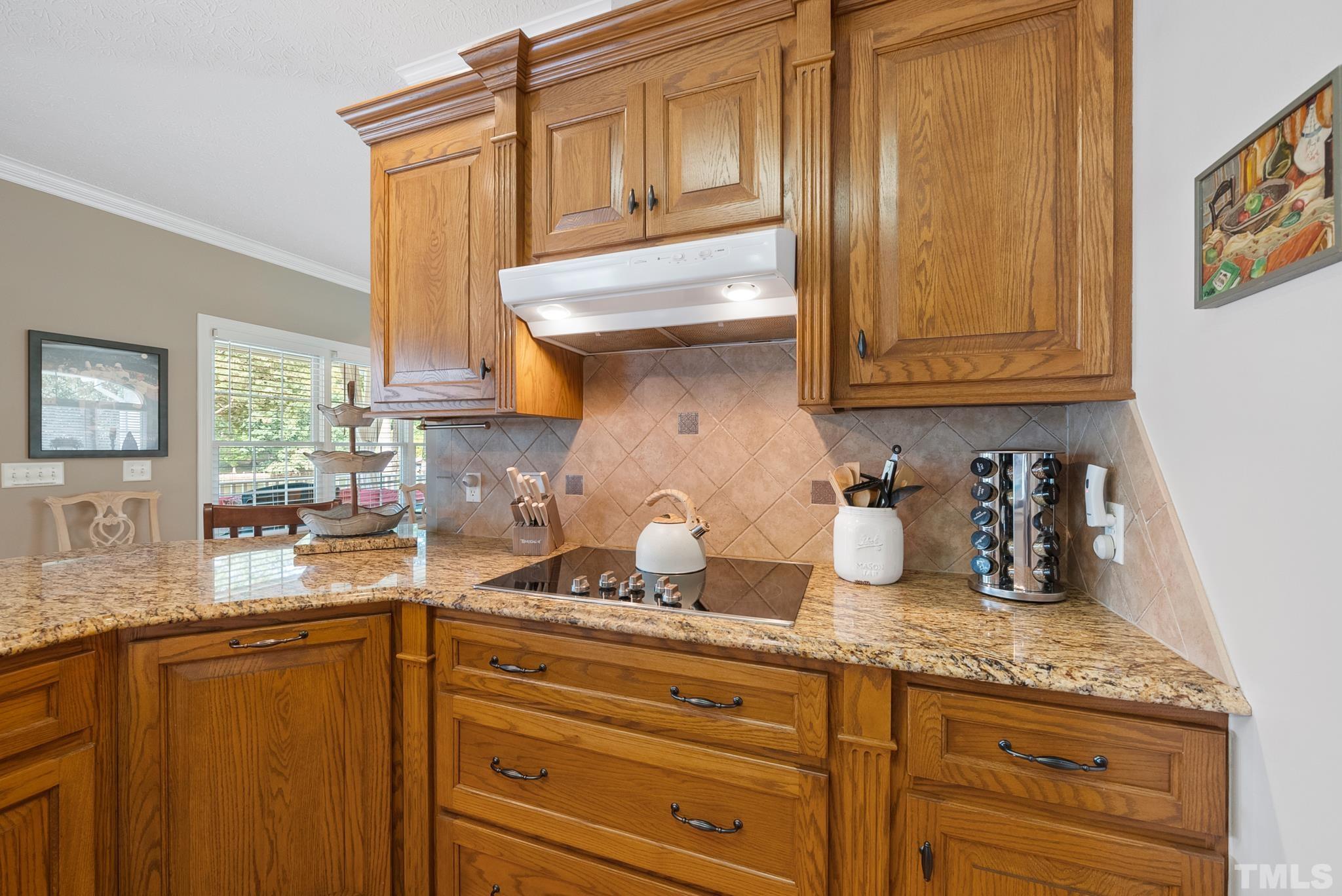 339 Velvet Road Semora, NC 27343 - Photo 63 of 68 a kitchen with granite countertop stainless steel appliances a sink and cabinets