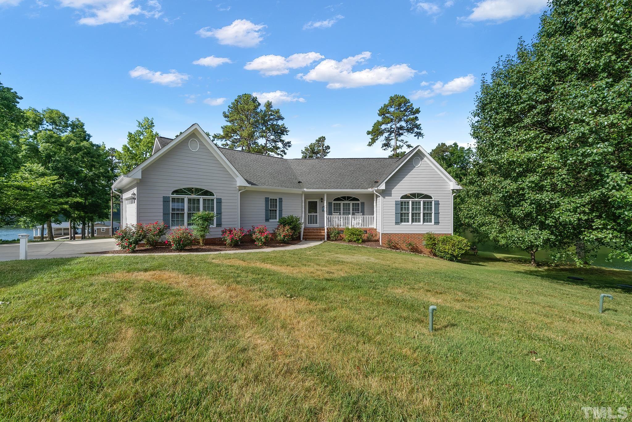 339 Velvet Road Semora, NC 27343 - Photo 64 of 68 a front view of a house with garden