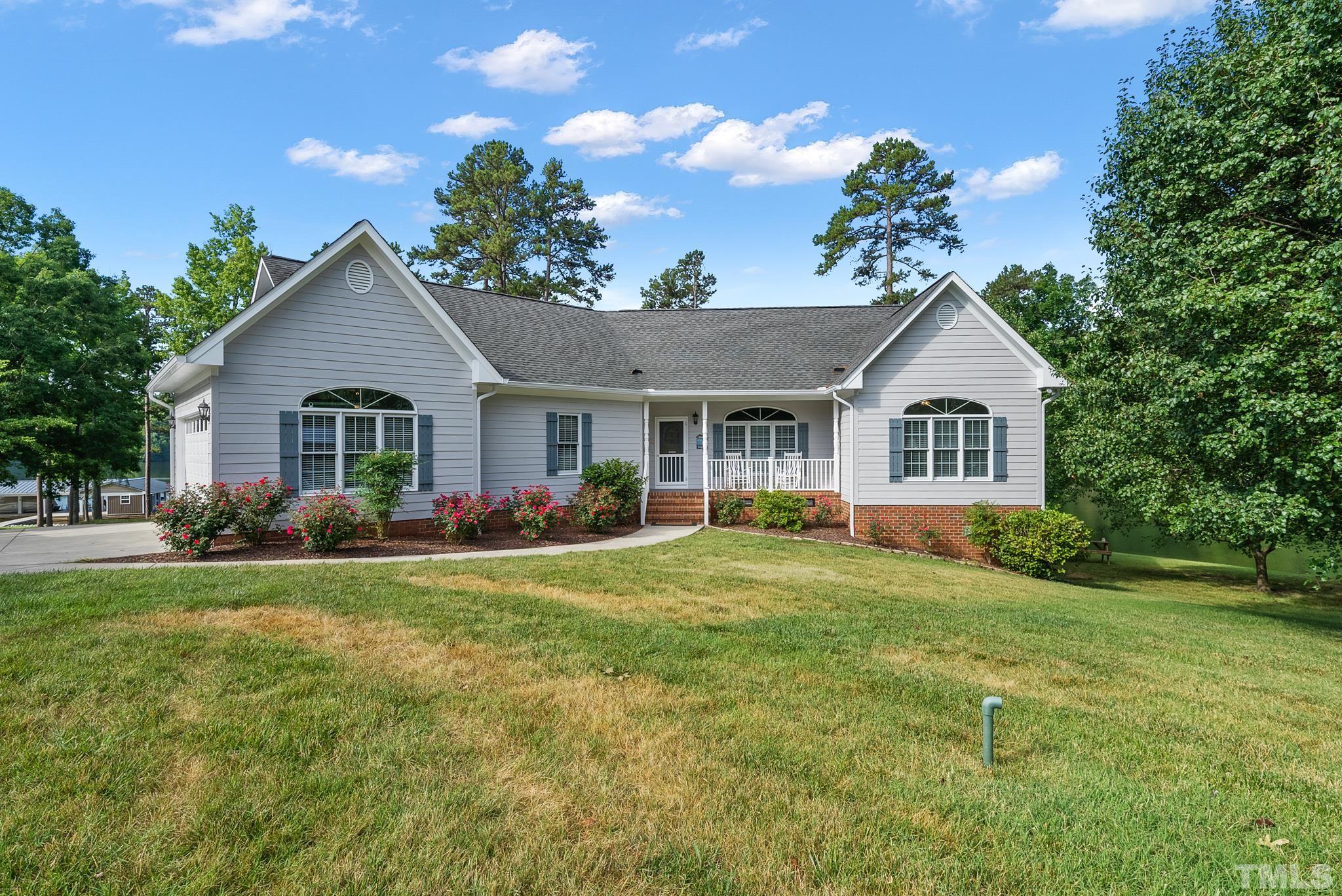339 Velvet Road Semora, NC 27343 - Photo 65 of 68 a front view of a house with garden